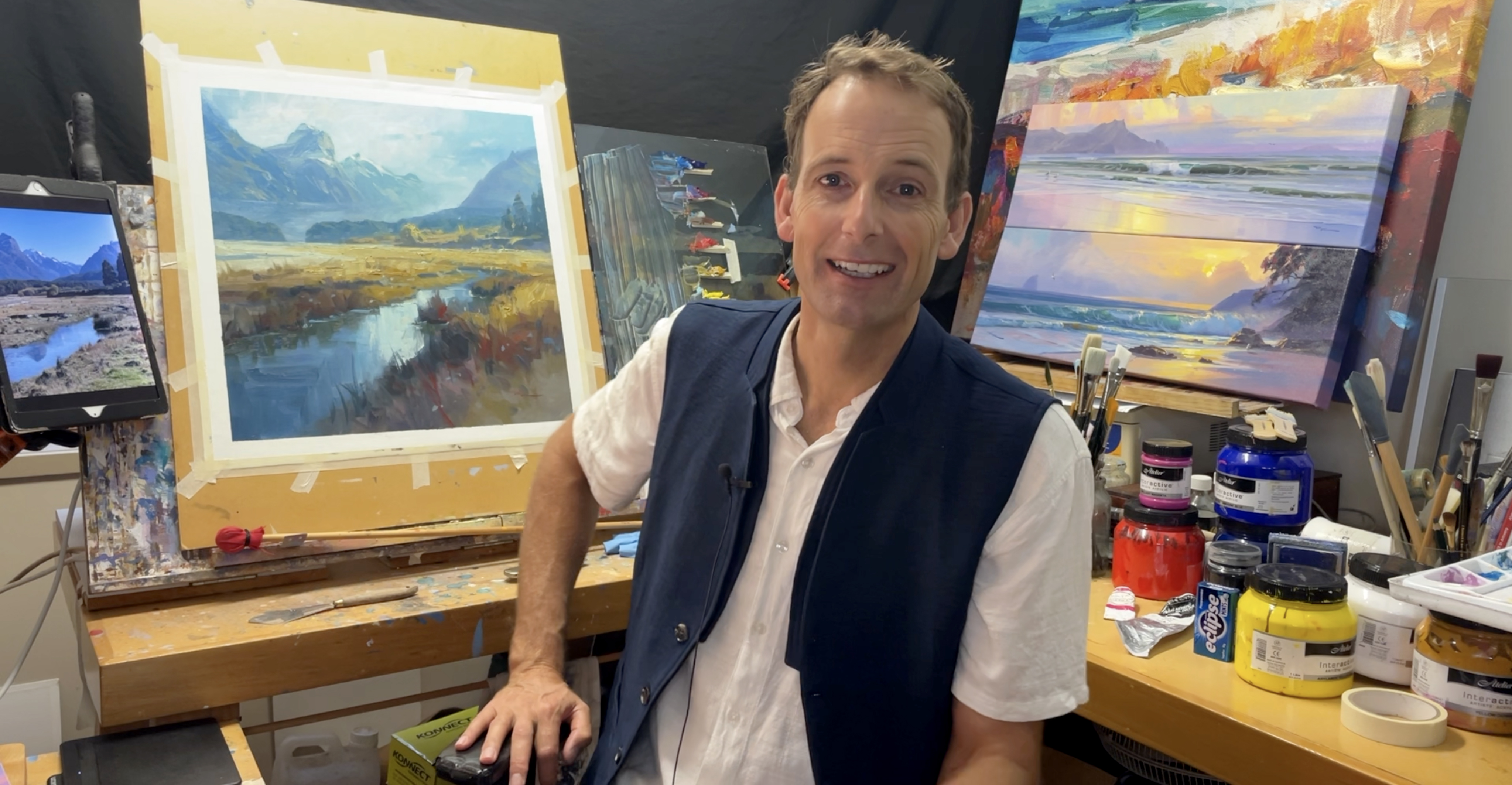 Richard Robinson painting in his studio